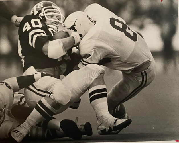 David Sherwood Hill playing football at Texas A&M