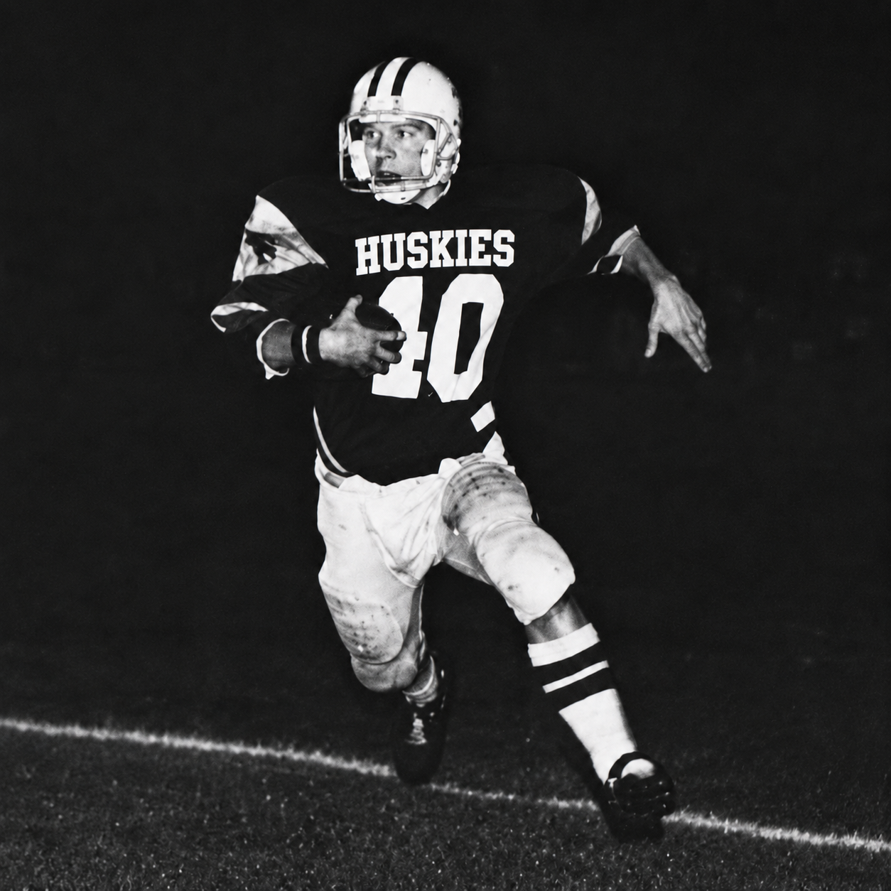 David Sherwood Hill playing football for the Holmes Huskies